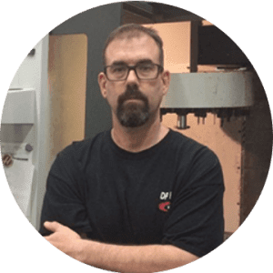 Individual in black shirt with glasses